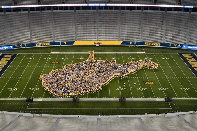 The Class of 2026 stands together in a West Virginia state formation. 