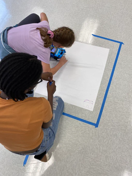 Students coding the rover to draw a picture