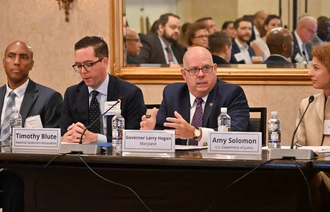 BJA Director Karhlton F. Moore sits in at a table with Office of Justice Programs Principal Deputy Assistant Attorney General Amy Solomon, Maryland Governor Larry Hogan, and others at the Institute for State Criminal Justice and Public Safety Executives, where attendees coordinated policy development and criminal justice planning to address public safety challenges.