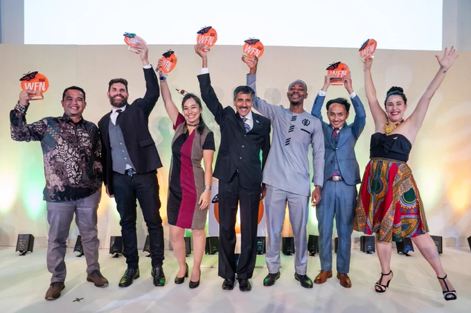 2022 Whitley Award winners celebrate with their trophies at the award ceremony.