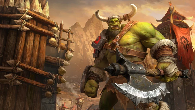 A large green orc carries a battle axe in front of the gates of an orcish encampment.