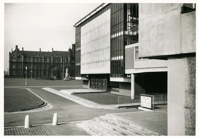 Old black and white image of Maxwell Hall with Peel building in the background.