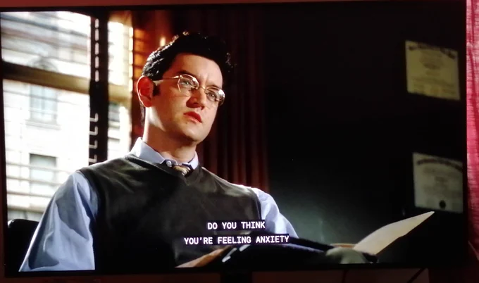 Screenshot from NYPD Blue season 8 episode 11 showing Timothy Omundson as a police psychologist. Subtitles read 'Do you think you're feeling anxiety...' 