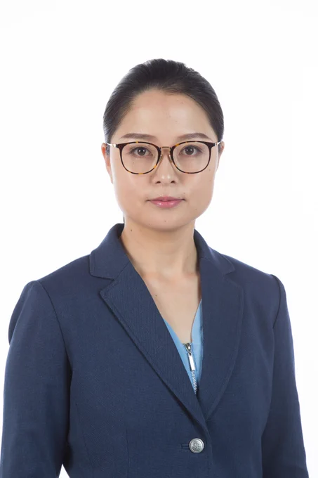 A photo of mechanical engineering associate professor Juan Ren. She is wearing a blue suit.