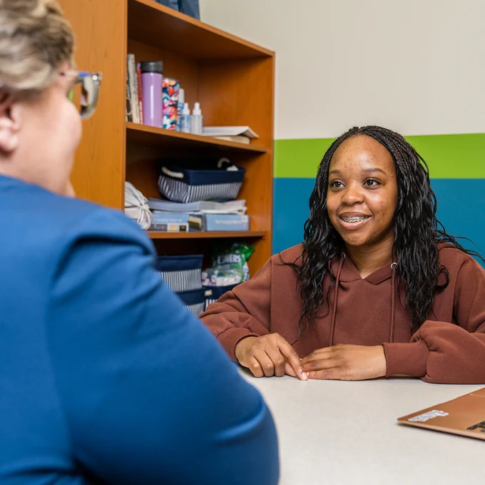 Patty Klug (left), director of the Chaiken Center for Student Success, meeting with a Liberal Arts student (right). 