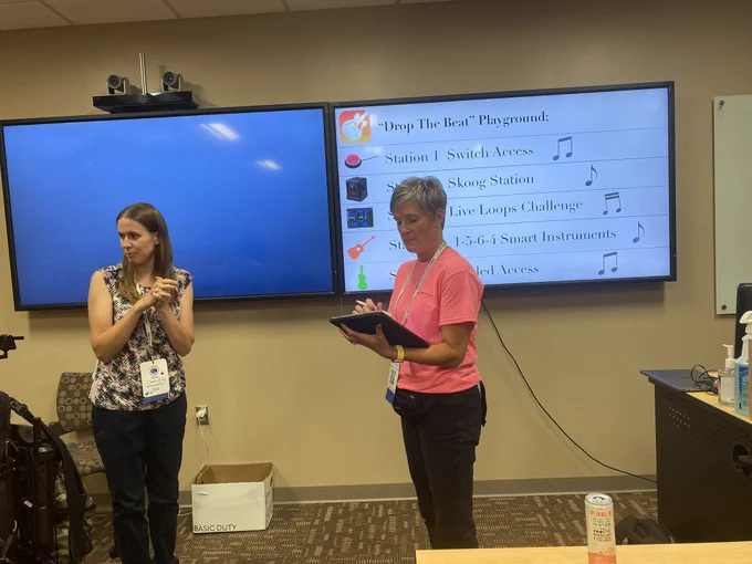 Two people teaching about Garageband