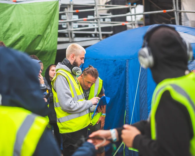 Two Solent Production crew members taking a look at the rota