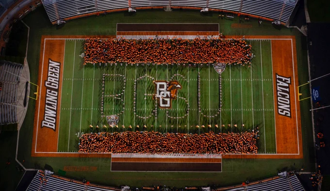 BGSU students and the Falcon Marching Band spell out the letters “bgsu” at the DOYT Perry Stadium