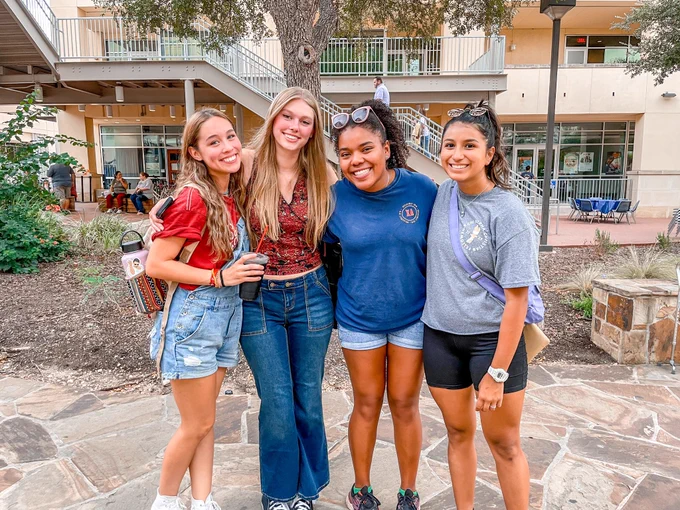 Four friends on their way to enjoy the Spirit of San Antonio.