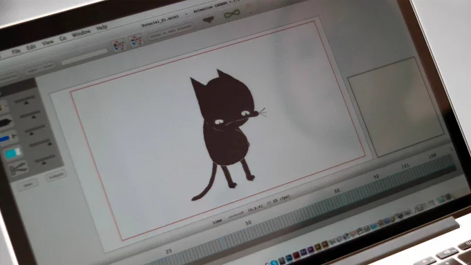 A still of a cartoon cat on a MacBook screen from A Cat Called Dom.