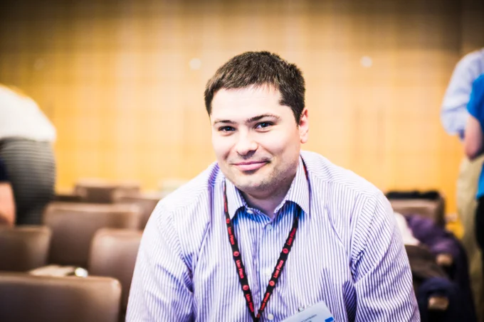 [This is a photo of a young man smiling at the camera.]