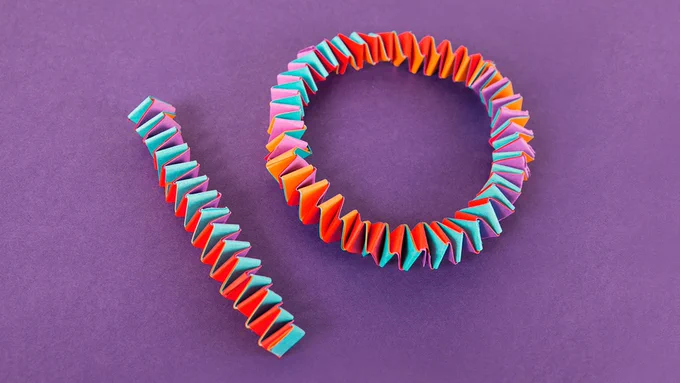 The numeral 10 constructed from colorful paper