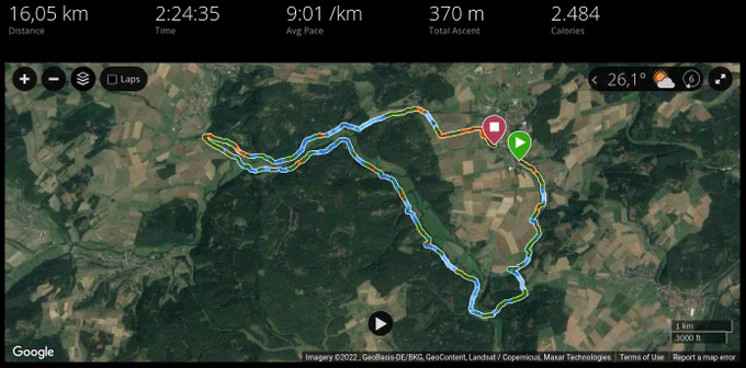 Screenshot of a satellite map with a colored line snaking through rural fields and forests, plotting my running path. The top indicates that I ran 16.05 kilometers in 2h 24m 35s at an average pace of 9:01 minutes/km and that I spent 2484 kilocalories.