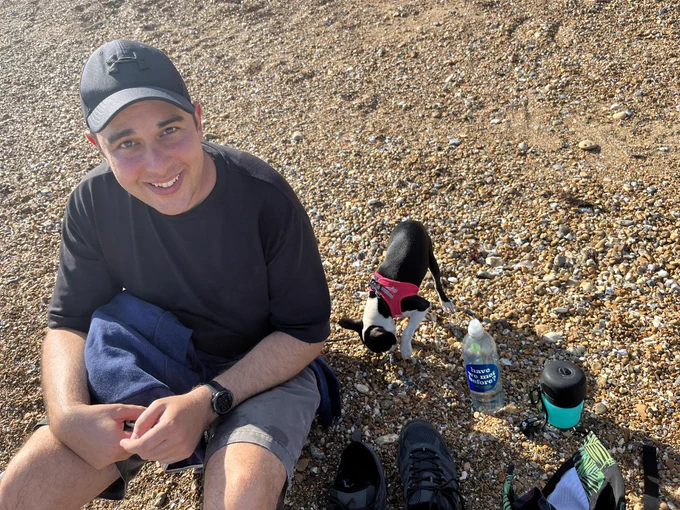 Jon and Freya taking a water break on the beach