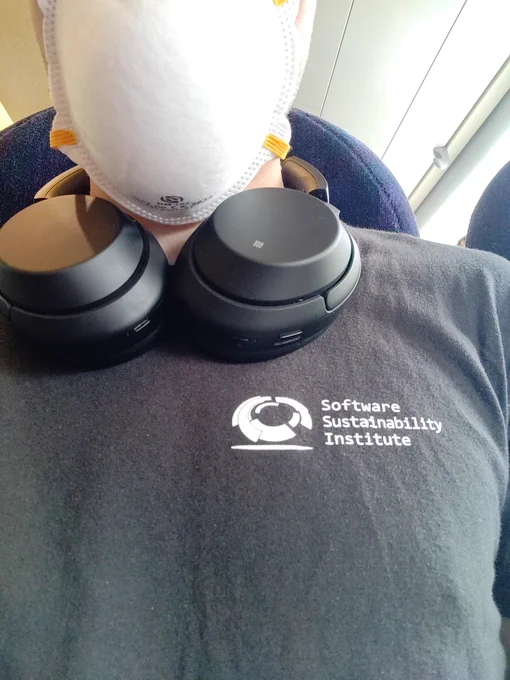Selfie with black T-shirt branded with "Software Sustainability Institute" on chest
