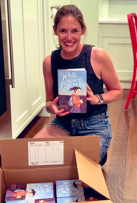 Image of author Caroline Gertler holding hard copy of WHERE YOU’VE GOT TO BE