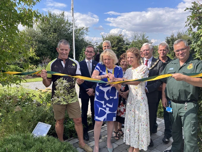The group cutting the ribbon at the Chelmsford garden.