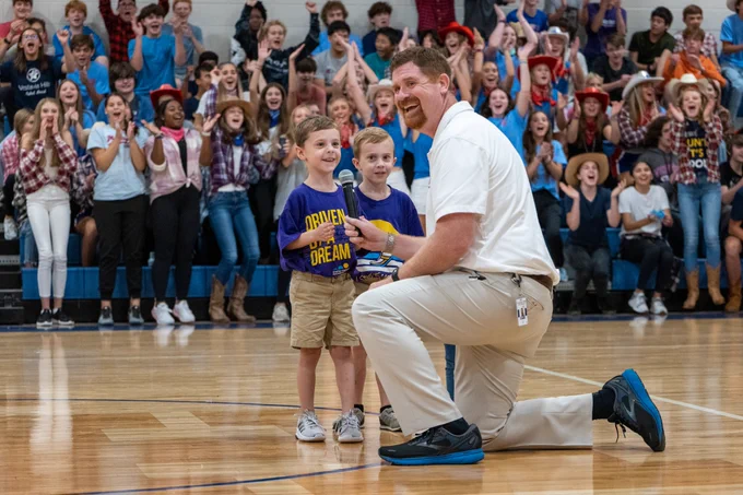 Two young students fire up the crowd at the Vestavia Hills High School Freshman Campus during the school's SGA Fall Charity Drive Kickoff.