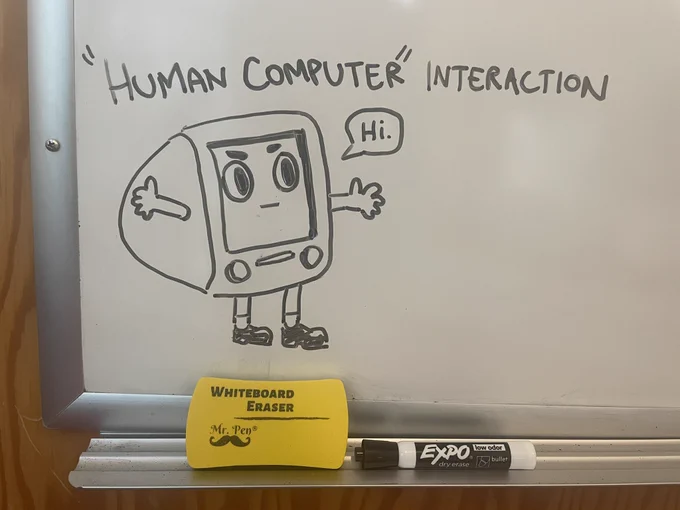 a whiteboard drawing of a humanlike computer saying “hi” with the words “‘human computer’ interaction” on top