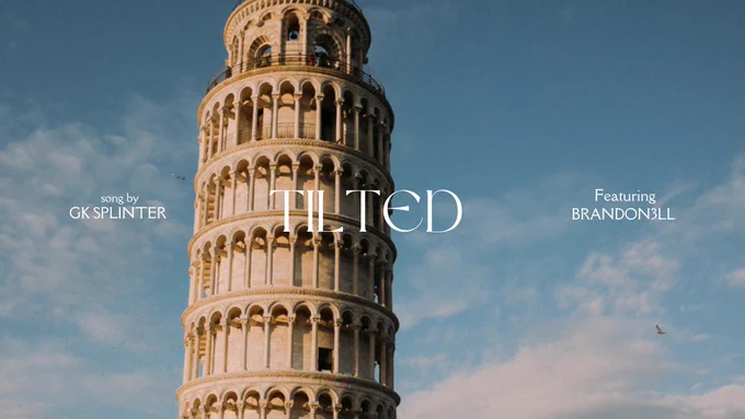 A clearly zoomed in picture of the Leaning Tower of Pisa with picture text written, Tilted a song by Gk Splinter featuring Brandon3ll