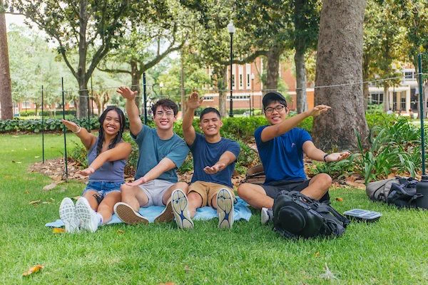 PHOTO: Students on the lawn doing the Gator chomp. University of Florida.