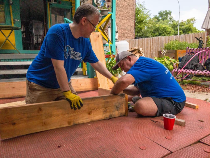 Volunteers from The Mission continues work on a garden bed