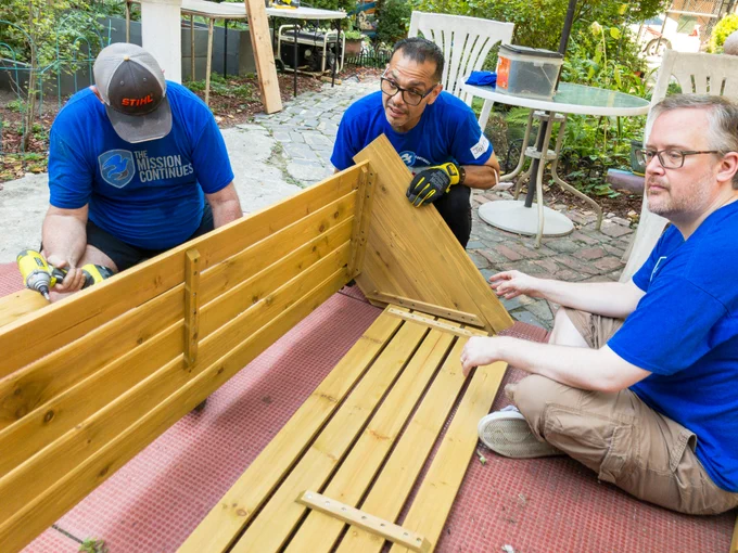 Volunteers from The Mission continues assemble a VegTrug