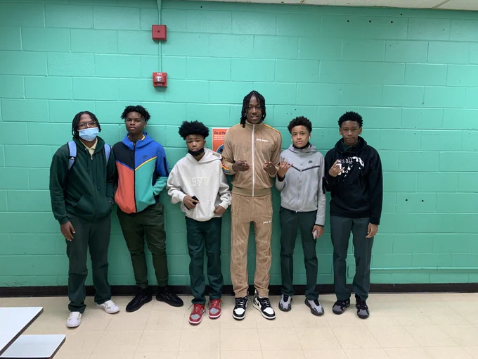 Former Beasley student, Ayo Dosunmu of the Chicago Bulls posed with Beasley's current basketball team on the first day of school