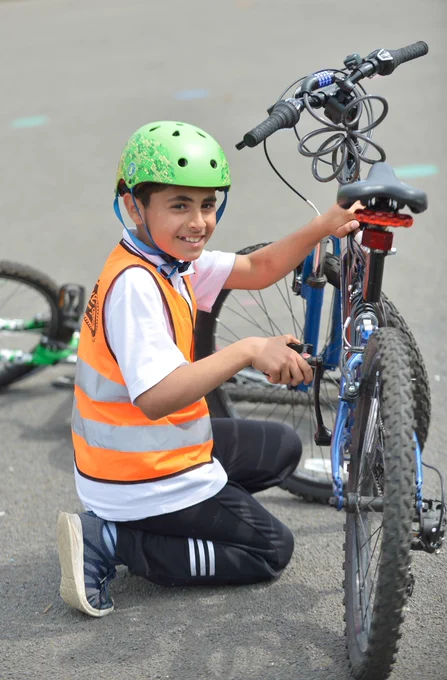 A school pupil enjoying free Bikeability Scotland cycle training at their Primary school. 