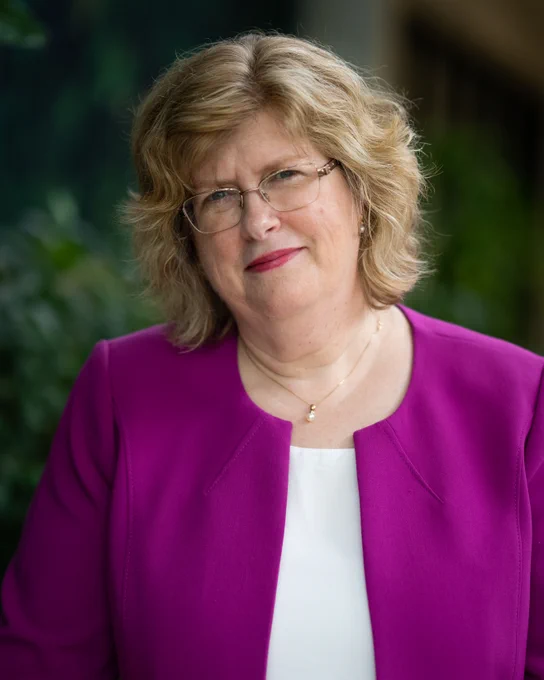 Dr. Ann Marie Vaughan wearing a purple blazer while smiling.