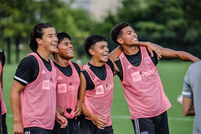 Owen Damm, Carlos Moguel Jr., Ray Serrano and Elijah Wynder smiling at this morning's training session.