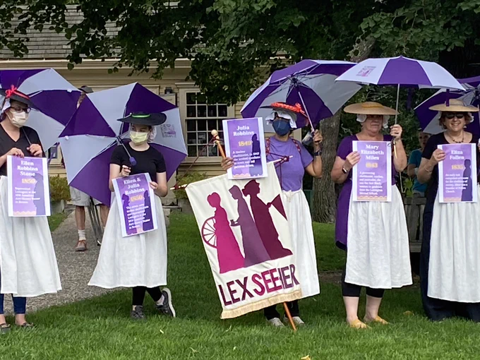 Community Endowment of Lexington (CEL) @LexEndowment is pleased to have funded in part the #Spinning Tableau by @LexSeeHer2, in Lexington MA on August 27, 2022. In 1769, forty-five women in Lexington brought their spinning wheels outside to protest the King's taxation on imported cloth. In the photo, you can see the cards the women are holding with the names and some biographical info about those who protested. CEL funded the supplies that volunteers used to make the aprons. Community Endowment of Lexington is an endowed fund of the Foundation for MetroWest. #womenmakinghistory #lexingtonma