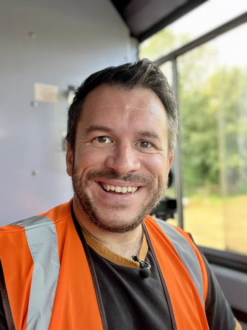 Me in my hi-viz in the drivers seat of the train