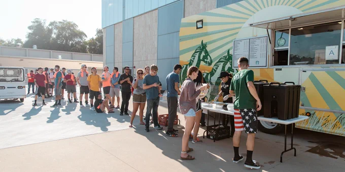 A line of students line up for food at the Poly Trolley.