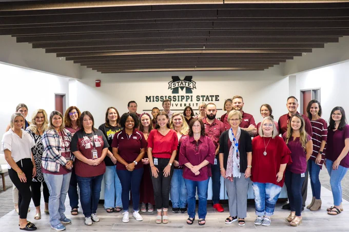 A group photo of MSU Office of Research and Economic Development personnel wearing maroon.