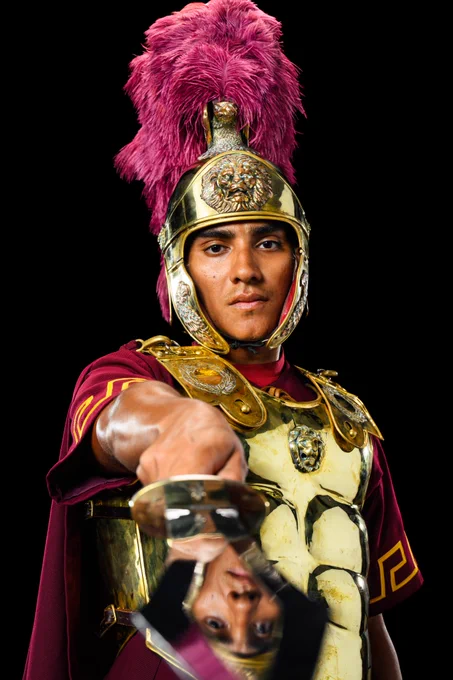 Photo of USC Drum Major pointing sword at camera