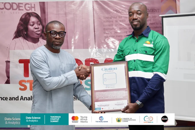 The CEO of iCode, Mr. Prince Bonney(Smart) Presenting a Citation to Mr. Aidoo Alfred CEO of Qlick Integration