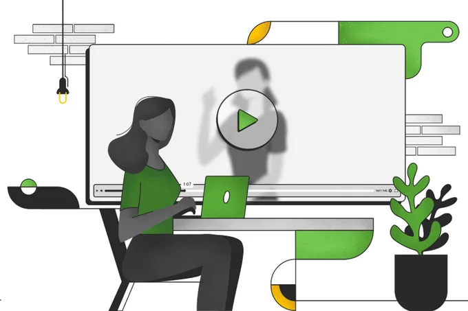 Student sitting at desk working on laptop with a large screen with a video player displayed. This is the new Proctorio Video Player.