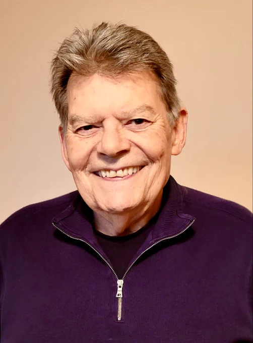Headshot of bandleader Les Brown, Jr. smiling.