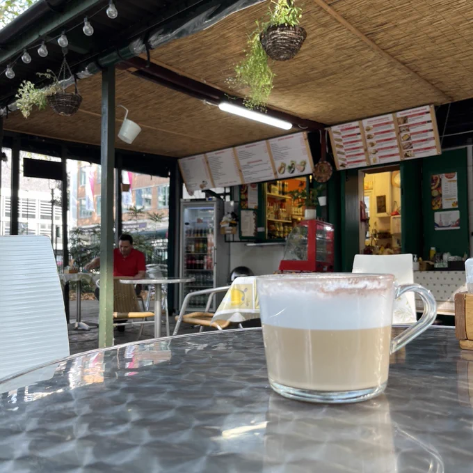 Coffee on a table in an open air cafe