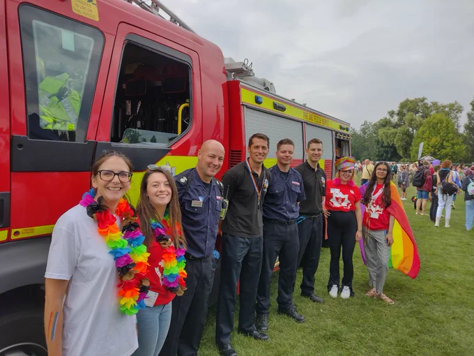 Group of people next to a fire engine
