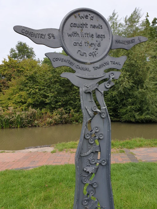 Metal sculpture Coventry canal towpath trail."We'd caught newts with little legs and they'd run off." Coventry 5 1/2 Hawkesbury 1/4.