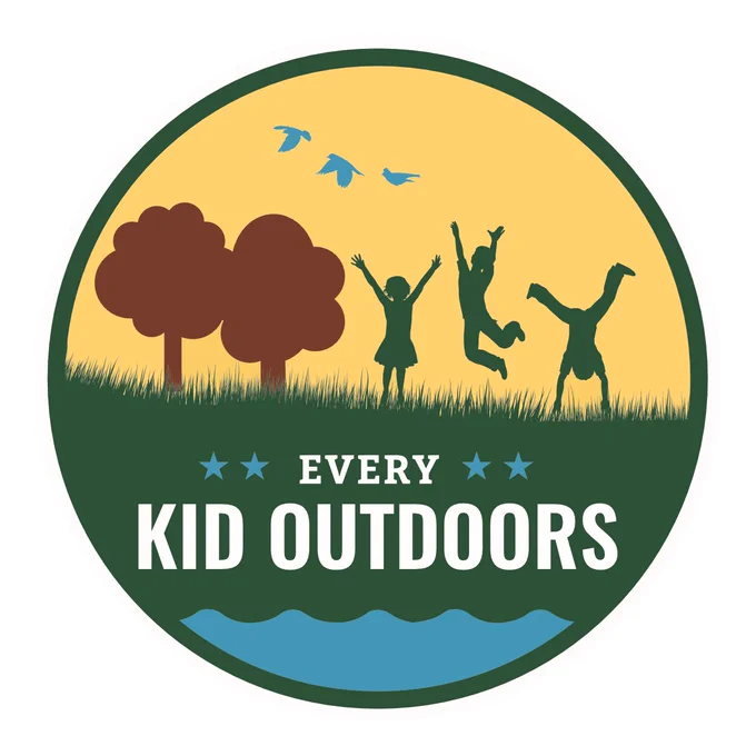 Illustrated trees with three kids playing next to them on top of a yellow background. Underneath in white font it reads “Every Kid Outdoors”