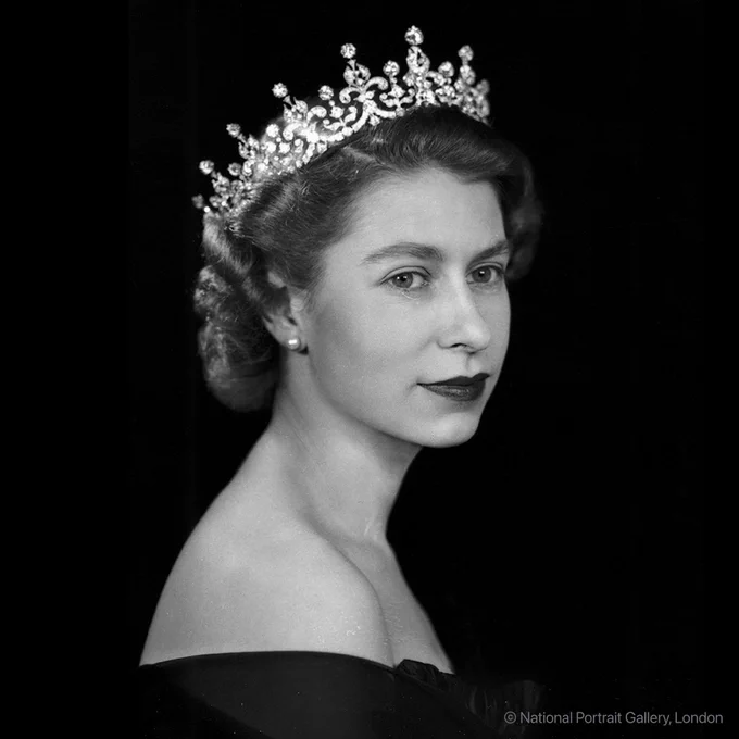 Queen Elizabeth II poses for an official coronation portrait wearing a tiara.