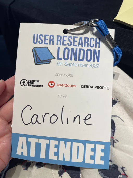 Conference pass on lanyard with title “User Research London” attendee and Caroline’s name.