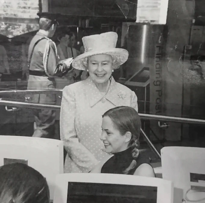 A black and white photograph of Her Majesty Queen Elizabeth II in the Millennium Library.