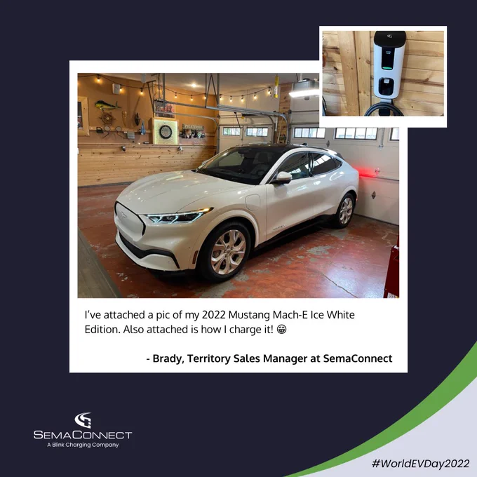 This image is designed to look like a Polaroid photo laid on top of a background which has a SemaConnect logo, SemaConnect's gray and green design swoosh, and the hashtag World EV Day 2022. Polaroid shows a white Mustang Mach-E in a parking garage and a SemaConnect Series 4 home charging station with the caption, "I’ve attached a pic of my 2022 Mustang Mach-E Ice White Edition. Also attached is how I charge it! 😁- Brady, Territory Sales Manager at SemaConnect