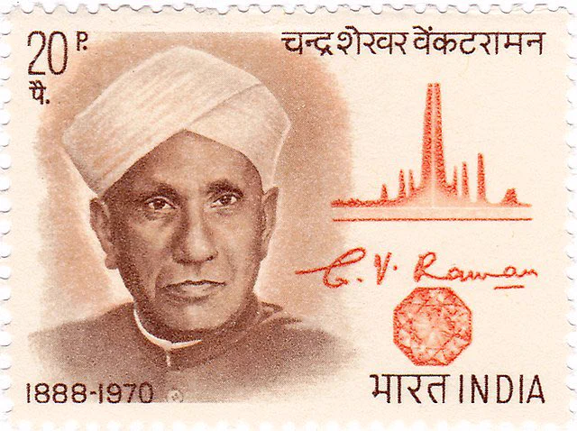 an Indian postal stamp from 1971, including a cartoon drawing of nobel laureate Raman, a cartoon crystal and a sketch of a graph of Raman scattering.