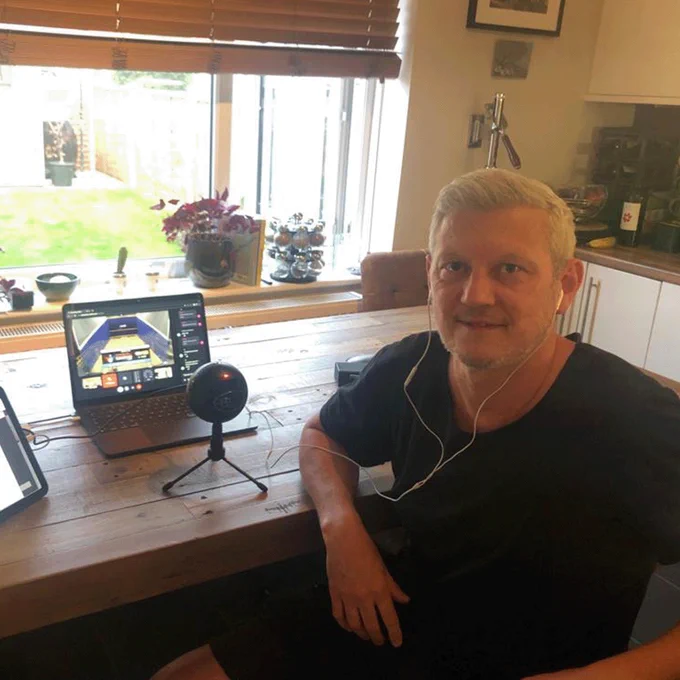 Simon Parke commentating on squash at home