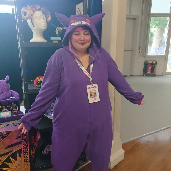 Person in a purple gengar pokemon onesie 